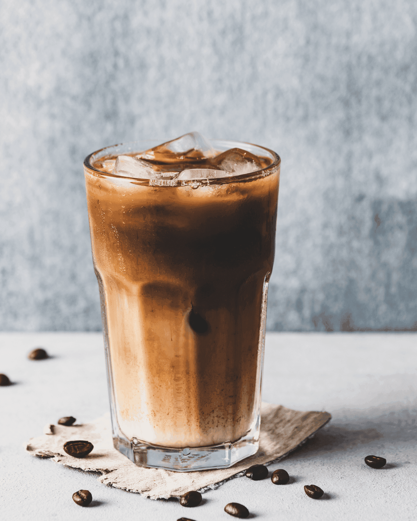 Chilled glass of iced coffee made with premium ice coffee powder served over ice