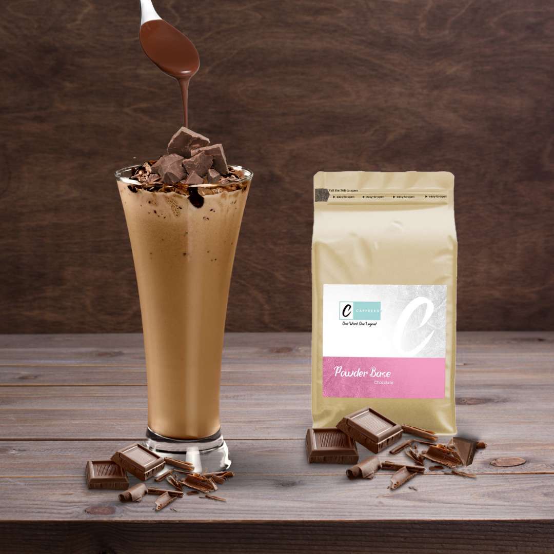 Caffeeegy.Co premium chocolate powder in a cream bag next to a chocolate drink topped with chocolate pieces