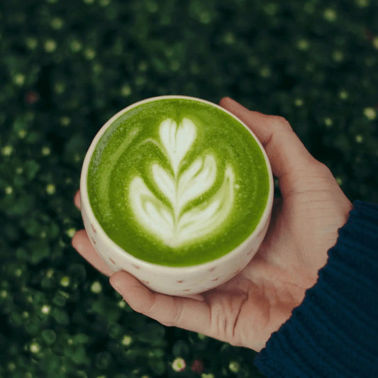 Caffeeegy.Co premium matcha latte powder in a beautifully frothed cup