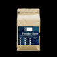 A stand-up pouch of Cappelen Powder Base high quality European raw materials, featuring a beige bag with a dark blue label on a solid black background.