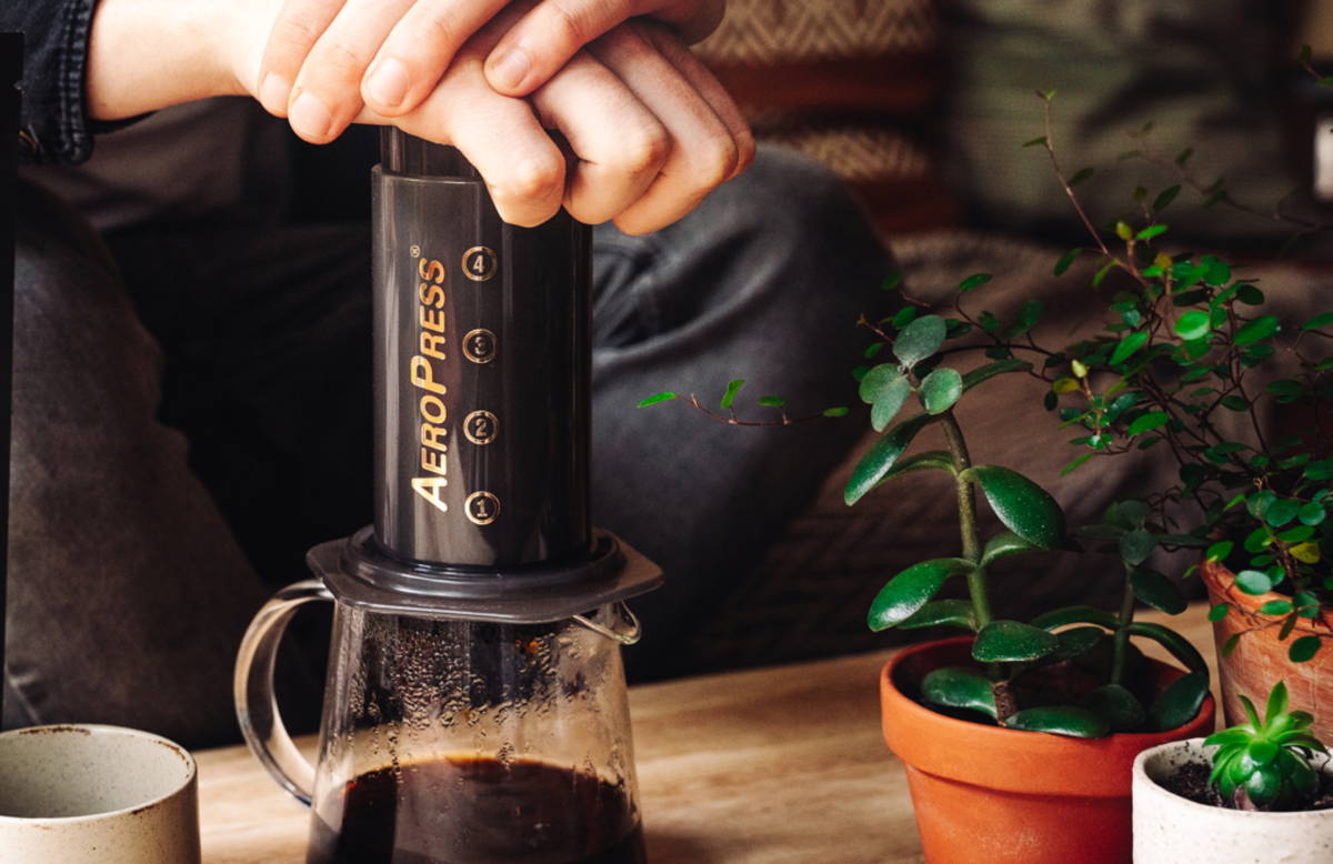 Brewing espresso using AeroPress with premium specialty coffee beans Egypt by Caffeeegy Co