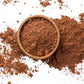 Caffeeegy.Co authentic cocoa flavors powder in a wooden bowl on a white background