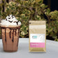 Caffeeegy.Co handcrafted mocha coffee mix beside a whipped cream topped mocha drink