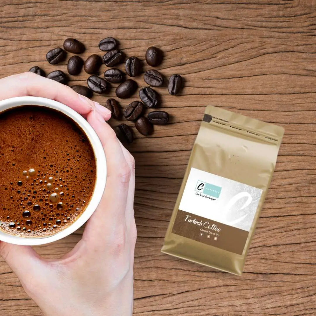 Caffeeegy.Co freshly roasted Turkish coffee beans brewed in a cup with whole beans on the side